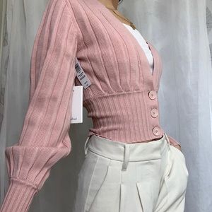 Pink plunge aritzia cardigan. Never worn, but tags were taken off.